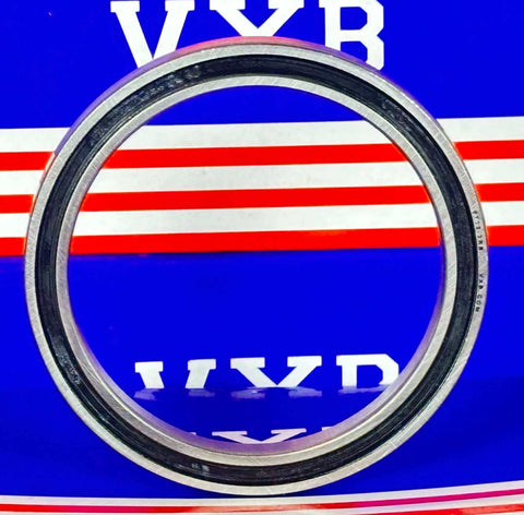 The Impact of Bearings on Energy Efficiency: Close-up of a bearing component on a blue and red background.