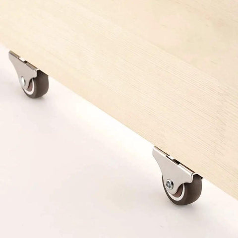 1 Inch Fixed Caster Wheels Set Of 4 With Silent Ball Bearings installed on wooden furniture for smooth rolling.
