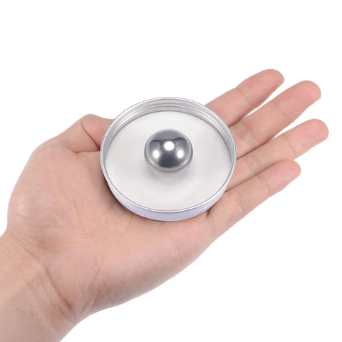 G100 1 Inch 304 Stainless Steel Precision Balls For Keychains And Bearings DIY Projects by uxcell displayed in a hand