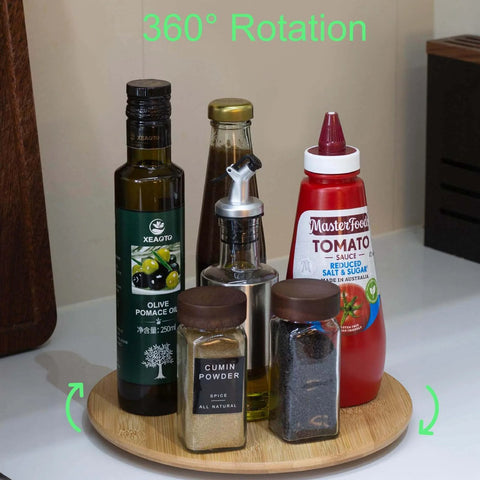 10 inch bamboo wood lazy susan organizer designed for cabinets and countertops with spices and condiments on it.
