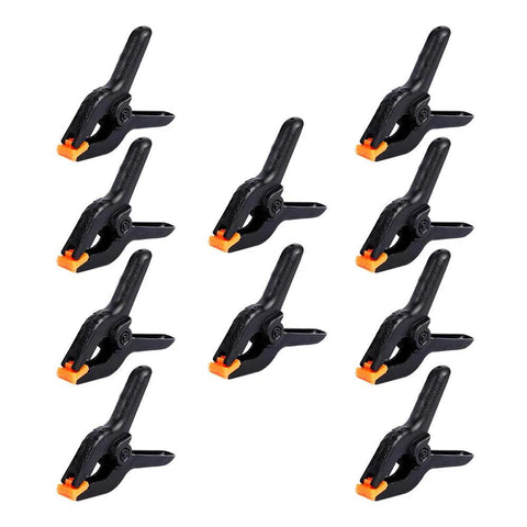 Ten 4.5-inch plastic spring clamps with orange jaws, heavy-duty backdrop clips by Amazon.