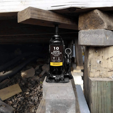 Beefy 10 Ton Hydraulic Bottle Jack For Auto Repair And Home Lifts With Wide Lift Range And Serrated Heat Treated Saddle By Torin Welded Construction Quality installed under wooden frame