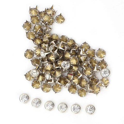 10 Mm Metal Studs And Claw Rivets Set For Clothing And Fabric Crafting, 100 Pcs displayed in a pile, showcasing copper and clear embellishments.