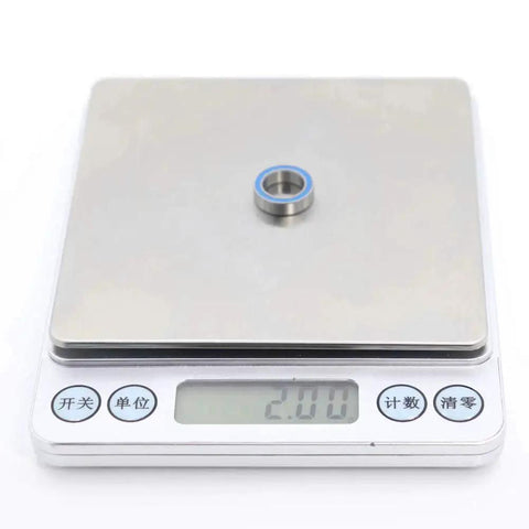 10x15x4mm Ball Bearings Set 6700 2RS Blue Rubber Sealed on digital scale weighing 2.00 grams