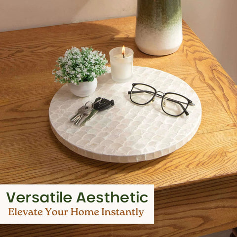12 inch white capiz lazy susan turntable centerpiece with keys and glasses on a wooden table