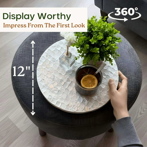 12 inch white capiz lazy susan turntable centerpiece on a table with drinks and a plant, showcasing its decorative use.