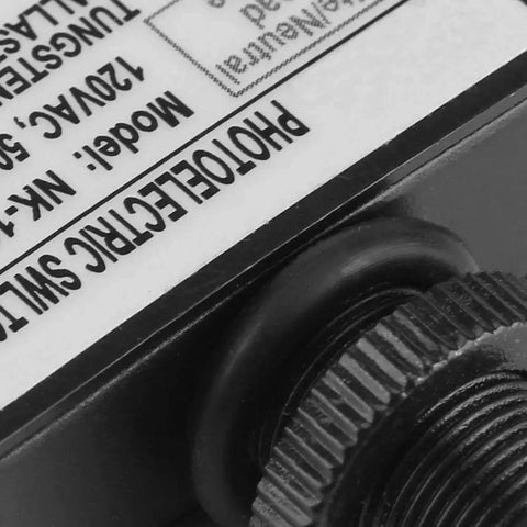 Close-up of 120V Outdoor Photoelectric Switch With Light Sensor, label detail and connection fitting, hard wired, energy-saving smart control.