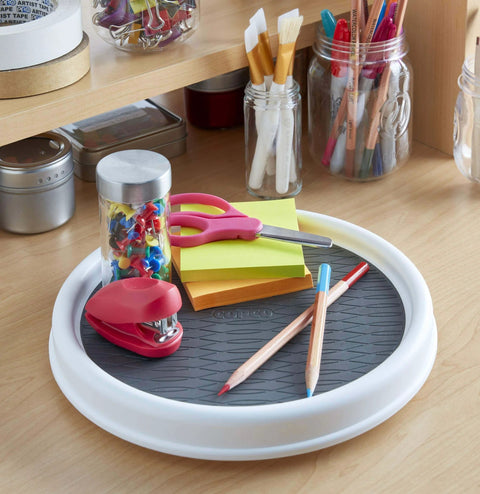 12 Inch Non Skid Pantry Lazy Susan Turntable, white and gray organizer with rimmed edge, holding office supplies on a wooden desk