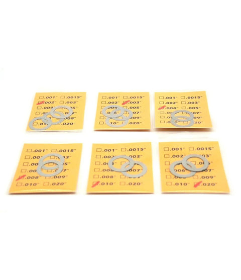 14 Pack Half Inch 28 TPI Barrel Shim Kit for .223 and 5.56 Muzzle Brakes displayed in clear segmented packaging, showing various thicknesses.
