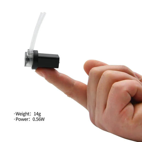 A 4ml/min Low Flow Rate mini peristaltic Pump 3.7V dc Motor with 1/16 Straight Through Pagoda Connector balanced on a fingertip.