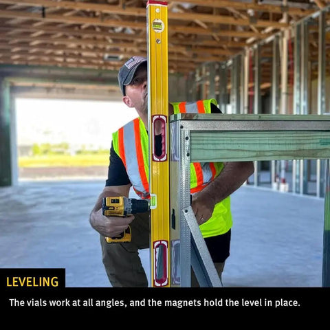 Construction worker using Stabila Type 96M Magnetic Level 16 Inch Professional Builder Tool with Rare Earth Magnets on metal studs