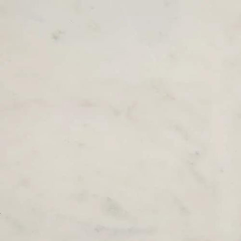 Close-up view of the surface of a 16 inch white marble lazy susan with gold edge, showcasing polished stone finish.