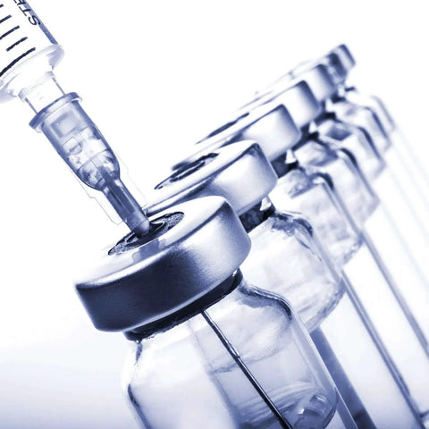 Syringe and vial demonstrating 18 Gauge 1 Inch Sterile Disposable Injection Needles With Cap 100 Pack For Scientific Research And Industrial Dispensing