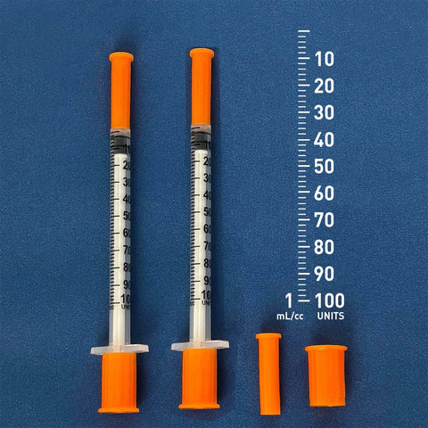 1cc Syringes With 31G Needle 5/16 Inch 8mm Individually Packaged 36 For Lab Use And Calibration with orange caps on blue background