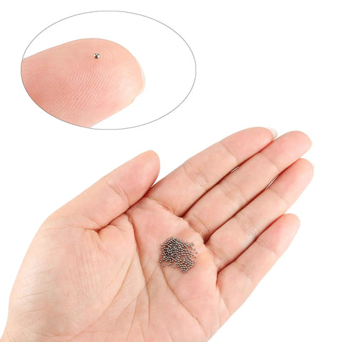 Person holding 1mm Precision Bearing Balls in 304 Stainless Steel G100 Grade 500 Count Pack for Precision Machinery and DIY Tinkerers by Uxcell