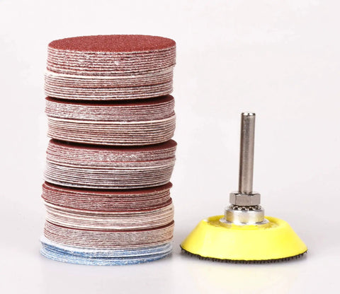 Stacked sanding discs and backing pad from 2 Inch Sanding Discs Set 80 To 3000 Grit With One Quarter Inch Shank Backing Pad