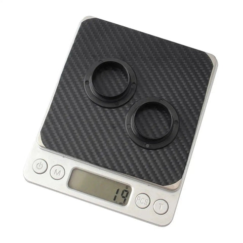 Two Pack Black Axle Protection Covers for Bike Bearings Dust Covers on digital scale