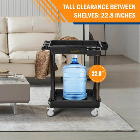Heavy Duty 2 Shelf Utility Cart Built Tough With 28 By 19 Inches Industrial Plastic Build 330 Pounds Capacity Locking Swivel Wheels Multipurpose Service Rolling Cart For Home Office And Industrial Use shown holding large water bottle indoors
