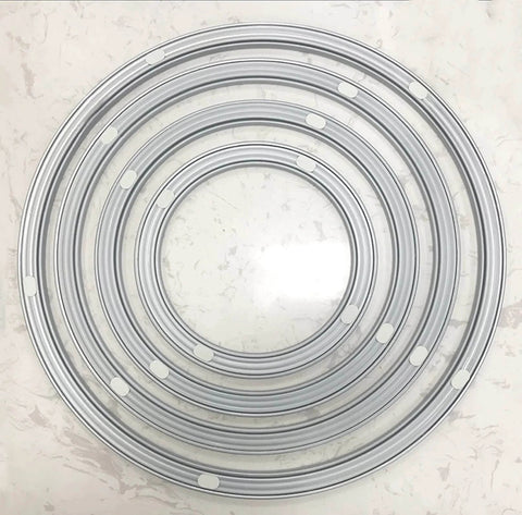 Top view of multiple round swivel plates showing the 20 Inch Heavy Duty Steel Lazy Susan Turntable Bearing on a marble surface.