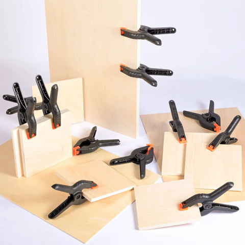 20-pack 3.5-inch black plastic spring clamps with orange jaws for woodworking and crafts