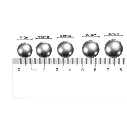 20mm carbon steel bearing balls next to a ruler, showcasing precision polished surface. Part of 10pcs 20mm Carbon Steel Bearing Balls Precision Polished.