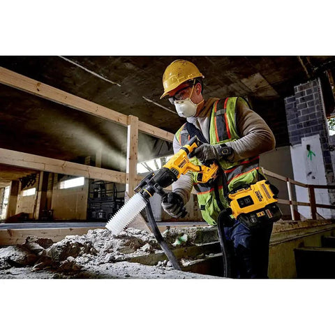 Construction worker using 20V Max SDS Plus Rotary Hammer With One And One Eighth Inch Capacity And Three Point Zero Joules Of Impact Energy