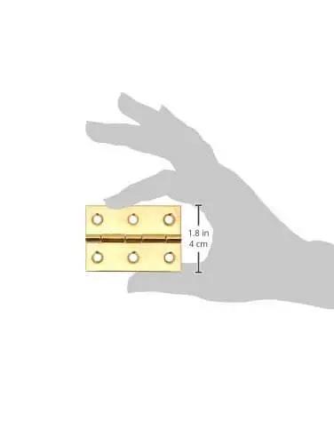 Bright brass 2-1/2 inch cabinet hinge, shown with hand for scale, part of Brass 2-1/2 Inch Cabinet Hinges Bundle, 2 Pack With Screws Included.