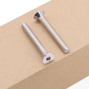 1/4-20 Flat Socket Cap Screws, 2-1/2 Inch Long, Full Thread, Countersunk Head, 304 Stainless Steel 18-8, laying on wood