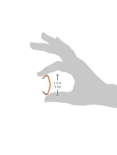 Hog Nose Ring Set With Hump Center Bend Copper Coated Pig Nose Rings Pack Of 100 for easy closure, shown in hand for size reference.