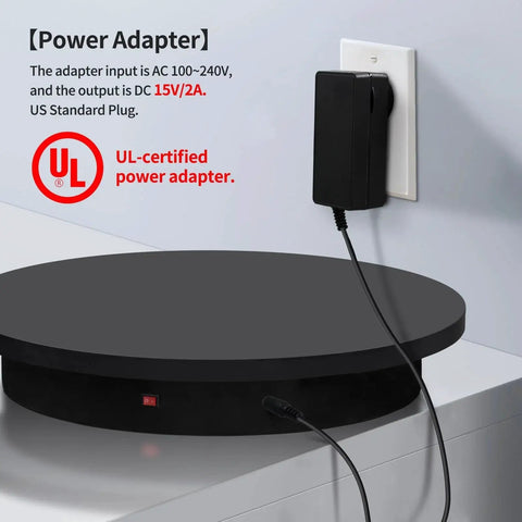 Power adapter for 23.6 Inch Remote Motorized Turntable For Photography And 3D Scanning, connected to wall socket.