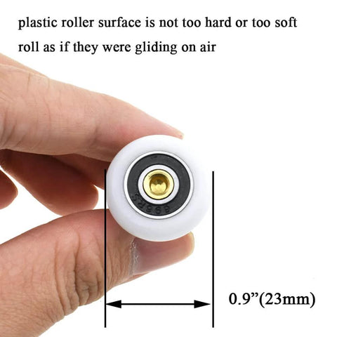 23mm diameter brass shower door wheels with nylon rollers and stainless steel screws held in hand displaying size