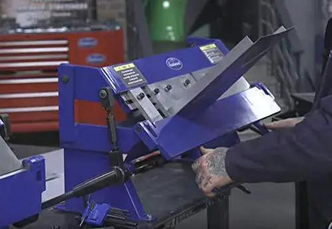 Person using 24 Inch Box And Pan Sheet Metal Brake With Five Adjustable Fingers For Small Shops Or Home Use in a workshop setting