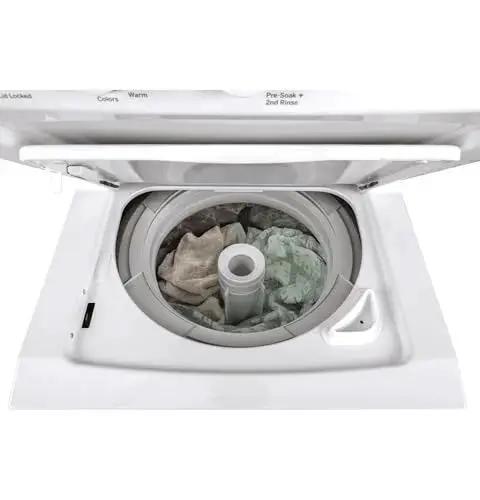 Compact 27 inch unitized washer and electric dryer in one space-saving cabinet with 3.8 cu ft top-load washer open view