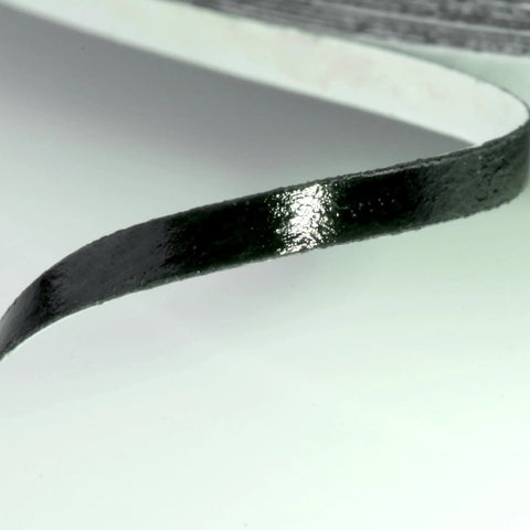 Close-up of 2mm double-sided adhesive tape for smartphone, tablet, and laptop LCD digitizer repair, showing glossy surface texture.