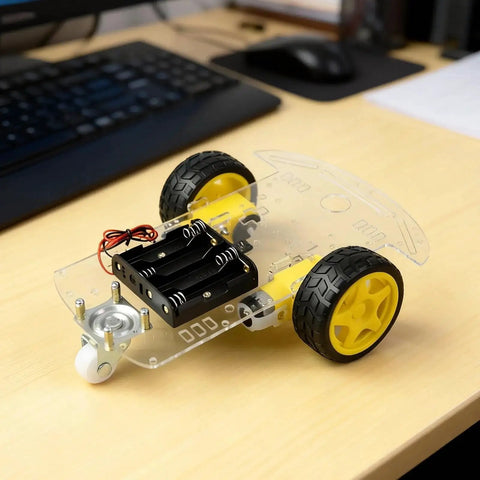 2WD Robot Car Chassis Kit With TT Motors Battery Box Acrylic Chassis And Two Wheels For DIY Projects on a desk