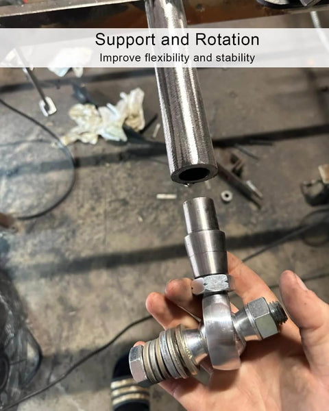 Hand holding chromoly spherical rod end from 3/4 inch Heim joint rod end kit with jam nuts, metal workspace background