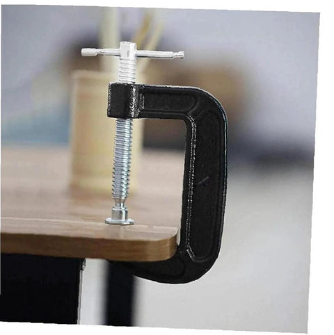 3 Inch Heavy Duty C Clamp Set clamping a wooden surface, showcasing industrial steel construction for woodworking and building, 2 pack