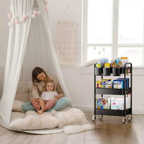 Heavy Duty 3 Tier Metal Rolling Cart With Wheels Ultra Sturdy Mesh Shelves Built In Hooks And Hanging Cups 110 Lbs Total Load Capacity With 36 Lbs Per Shelf Perfect For Kitchen Office Or Craft Room Lightweight Yet Tough Steel Design YASONIC shown in a cozy living room setting.