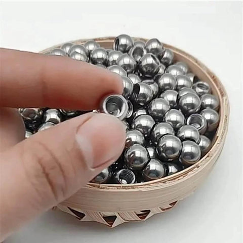 Hand holding 304 Stainless Steel Threaded Steel Ball, Half-Hole Threaded Steel Ball, M2 Drilled Threaded Steel Ball, Round Nut, Thread Diameter 2mm, Steel Ball Diameter,20mm*3pcs, showing threaded hole and polished surface, with more balls in a basket