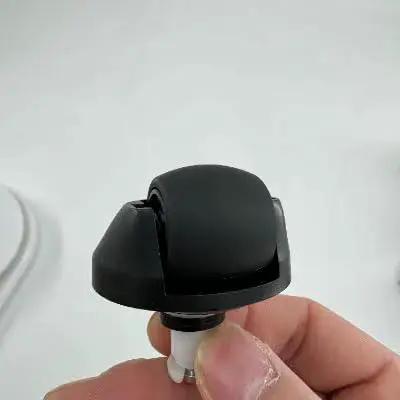 Must Have Omni Directional And Swivel Wheel Replacement Kit For Dreame Robot Vacuums shown with a black omni-directional wheel in hand.