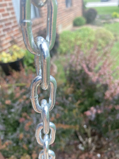 Close-up of bright zinc-plated metal chain outdoors, 3/16-IN X 10-FT Heavy Duty Proof Coil Chain, 800lbs Safe Load Capacity