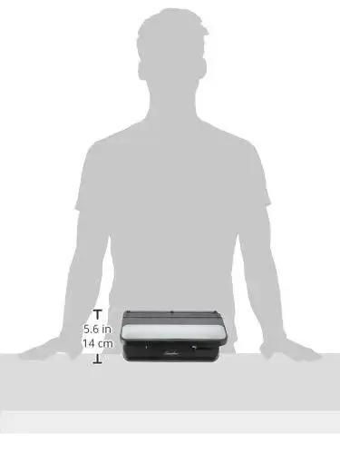 Heavy Duty 2 To 7 Hole Punch With Adjustable Head And Easy Touch Handle 32 Sheet Capacity next to silhouette for size comparison.