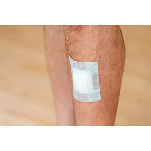 Strong Hold Pain Free Tape For Sensitive Skin 1 Roll 1 In X 4 Yds Silicone applied on leg showing secure hold on skin