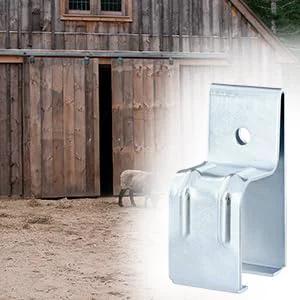 Beefy Heavy Duty Box Rail Hanger Brackets for Barn Doors, galvanized steel, shown installed on a wooden barn