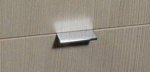 2 Inch Edge Pull in Polished Chrome for cabinets and drawers installed on wood surface, showcasing modern sleek hardware and durable finish.