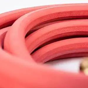 Close-up of coiled All Rubber Hot And Cold Water Hose, 5/8 Inch By 50 Feet, with rigid sleeve, crush resistant and durable construction.