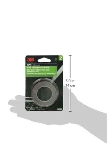 Super Strength Automotive Tape 03609 - 1/2 in x 5 ft single roll packaging held in hand for size reference