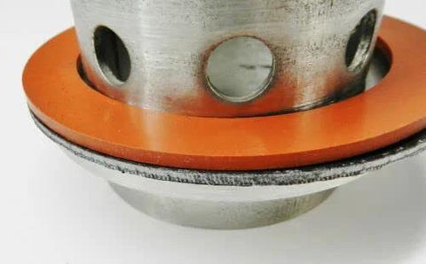 Vacuum casting gasket set, 3-1/2 inch, silicone rubber and graphite, orange gasket around a perforated metal flask.