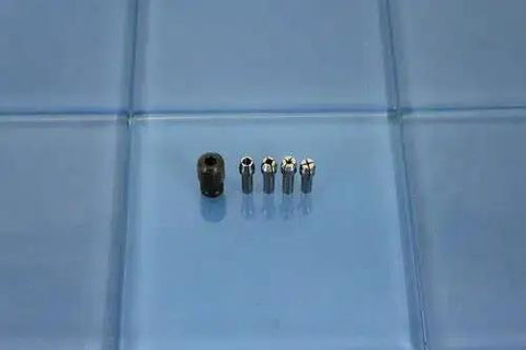 Quick Change Collet Nut Kit Set 4485 Built Tough for Dremel and Compatible Rotary Tools displayed on blue surface