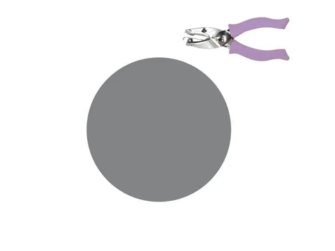 Image of Purple Circle Hand Punch 1/4 Inch For Crafts With Cushioned Grip, shown next to a punched circle, durable craft tool.
